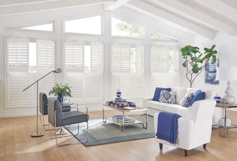 Living room with custom window treatments enhancing natural light and interior style.